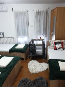 Postel nebo postele na pokoji v ubytování Apartment Božur
