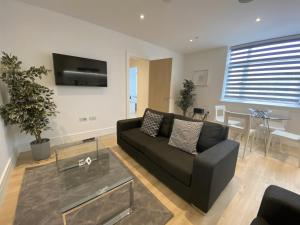 Μια τηλεόραση ή/και κέντρο ψυχαγωγίας στο Roomspace Serviced Apartments- Syward Place