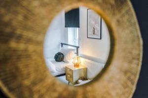 a view of a bedroom with a bed and a lamp at 4 Bedroom House Eccles in Manchester