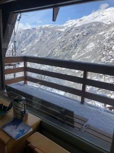 a window with a view of a snow covered mountain at Chalet charme vista panoramica sauna idromassaggio (Chalet Fanella) in Valtournenche
