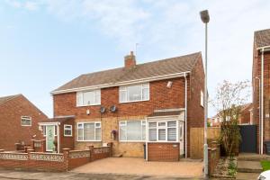 an image of a brick house with a driveway at St Lawrence in Pittington