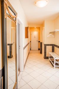 a hallway with a tile floor and a door at Haus Helga in Idar-Oberstein