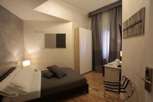 Postel nebo postele na pokoji v ubytování Attico Volta B&B