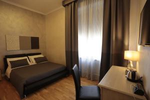 Postel nebo postele na pokoji v ubytování Attico Volta B&B
