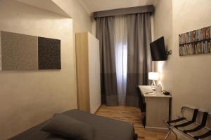 TV a/nebo společenská místnost v ubytování Attico Volta B&B