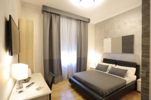 Postel nebo postele na pokoji v ubytování Attico Volta B&B