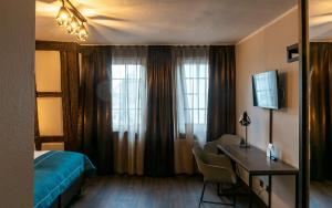 TV a/nebo společenská místnost v ubytování Trip Inn Hotel Sachsenhausen