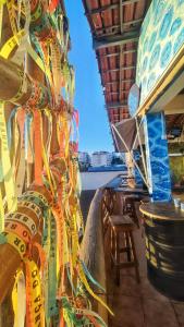 a bunch of ribbons hanging on the side of a ship at Hostel Recanto da Sereia in Salvador