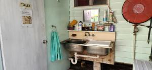 a kitchen with a sink in a room at Meyenburg Family Room in Mount Morgan