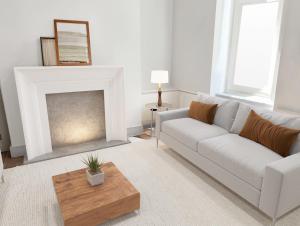 a living room with a couch and a coffee table at Stylish 3 Bedrooms in London