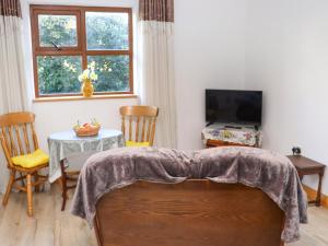 Televiisor ja/või meelelahutuskeskus majutusasutuses Wheatfield Lodge