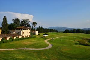a view of a golf course with a building at Roma27 Scarperia in Scarperia