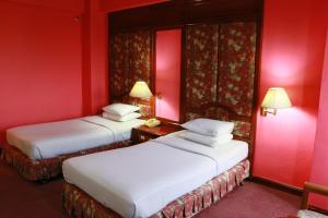 Letto o letti in una camera di Diamond River Ping Petch-Ngam Hotel