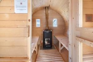 an inside view of a small stove in a wooden cabin at Casa Colturi Abete in Valdisotto