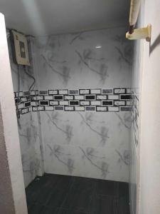 a bathroom with a marble shower with a phone on the wall at Stay 7 Jomtien Resort in Jomtien Beach