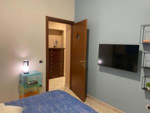 TV a/nebo společenská místnost v ubytování Pompei Home Apartament