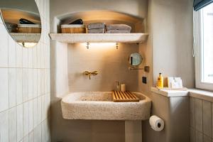 a bathroom with a sink and a mirror at 7oaks Noble House in Dubrovnik