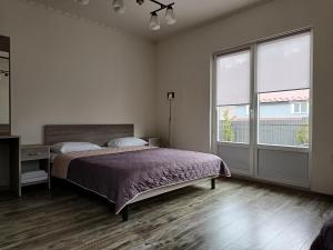 Postel nebo postele na pokoji v ubytování Готель Ципа