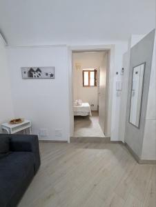 Ένα ή περισσότερα κρεβάτια σε δωμάτιο στο Casa nel borgo della tranquillità +12 φωτογραφίες