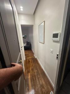 a person opening a door to a room with a hallway at Cosy Apt 4P-porte maillot -palais des congrés in Paris