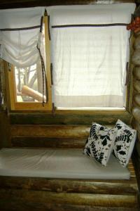 a room with a window and two pillows on it at Casal de Morgade in Villa Ciudad Parque