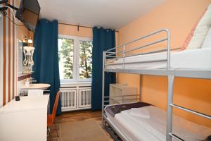 Ein Bett oder Betten in einem Zimmer der Unterkunft Self check in City Hostel Nordstern
