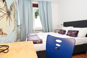 Ein Bett oder Betten in einem Zimmer der Unterkunft Self check in City Hostel Nordstern