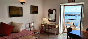 a living room with a table and a view of the water at Seaside apartment in Krk