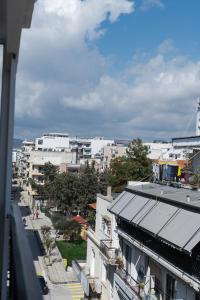 a view of a city with buildings and a street at Magico Home City Heart Luxury Appartment in Alexandroupoli