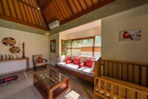 Tempat tidur dalam kamar di The Puspita House