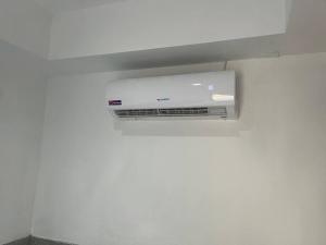a wall mounted air conditioner on a wall at Sunset Serenity Cove in Ko Phangan