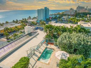 an aerial view of a resort with a pool and the ocean at Rooftop infinity Pool - Hollywood Beach Broad - walk in Hollywood