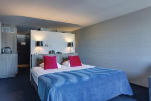 Postel nebo postele na pokoji v ubytování Van der Valk Hotel Liège Congres