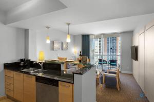 a kitchen with a sink and a counter top at Beachfront Resort POOL OCEAN VIEW BALCONY in Miami Beach