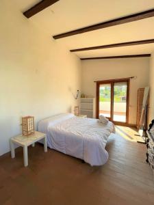 a bedroom with a large bed and a window at Villa Grao Castellon Ref 053 in Grao de Castellón