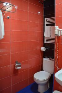 a bathroom with a toilet and a sink at Loop INN Hostel Santiago de Compostela in Santiago de Compostela