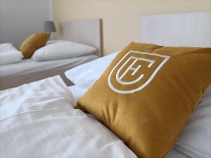 Postel nebo postele na pokoji v ubytování Hotel Eminent