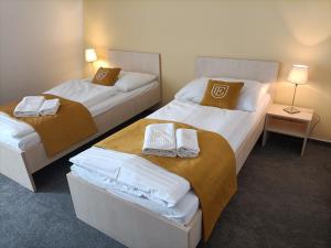 Postel nebo postele na pokoji v ubytování Hotel Eminent