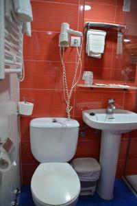 a bathroom with a toilet and a sink at Loop INN Hostel Santiago de Compostela in Santiago de Compostela