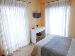 Posteľ alebo postele v izbe v ubytovaní Hotel Cais