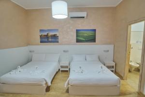 Postel nebo postele na pokoji v ubytování Bel Sole Guest House