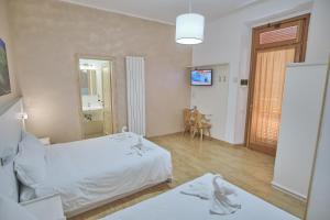 Postel nebo postele na pokoji v ubytování Bel Sole Guest House