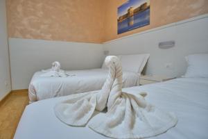 Postel nebo postele na pokoji v ubytování Bel Sole Guest House
