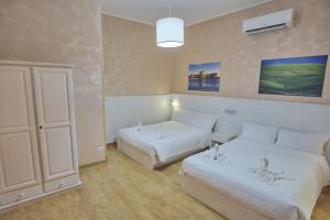 Postel nebo postele na pokoji v ubytování Bel Sole Guest House