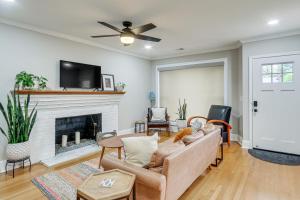 a living room with a couch and a fireplace at Updated Columbia Home with Patio - 4 Mi to USC! in Columbia