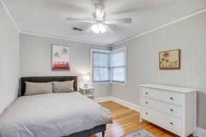 a bedroom with a bed and a ceiling fan at Updated Columbia Home with Patio - 4 Mi to USC! in Columbia
