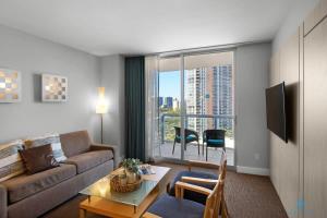 a living room with a couch and a table at New Sunny Isles: Oceanview Comfort Stay in Aventura