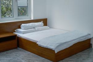 Krevet ili kreveti u jedinici u objektu Green Villa - Ngôi Nhà Chung