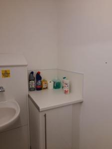 a bathroom with a sink and a white counter top at Private Ensuite Room next to A34 in Birmingham