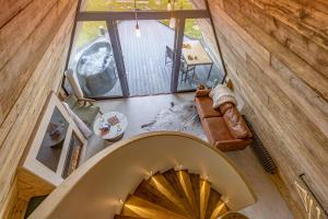 an overhead view of a spiral staircase in a house at The Tri-Pod in Llanarth